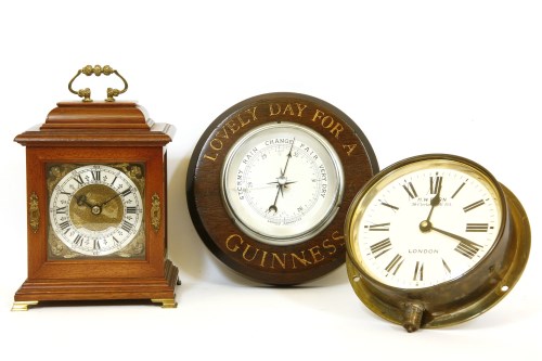 Lot 271 - A reproduction table clock by Biddle and Mumford
