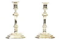 Lot 112 - A pair of silver candlesticks