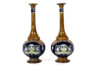 Lot 322 - A pair of Royal Doulton stoneware bottle shaped vases