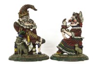 Lot 331 - A pair of cast iron hand painted Punch and Judy door stops