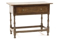 Lot 539 - An early 18th century oak single drawer side table