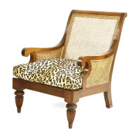 Lot 593 - A teak lounge armchair