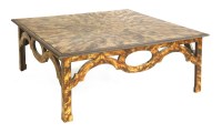 Lot 601 - A faux tortoiseshell coffee table