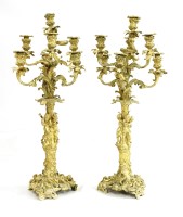 Lot 612 - A pair of gilt bronze candelabra