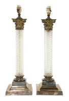 Lot 615 - A pair of silver-plated and cut glass table lamps