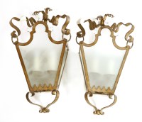 Lot 627 - A pair of patinated metal wall lights