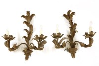 Lot 475 - A pair of metal twin-branch wall lights