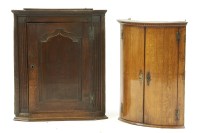 Lot 606 - Two oak hanging corner cupboards