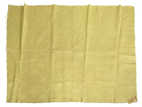 Lot 1295 - A segment of quilted yellow silk