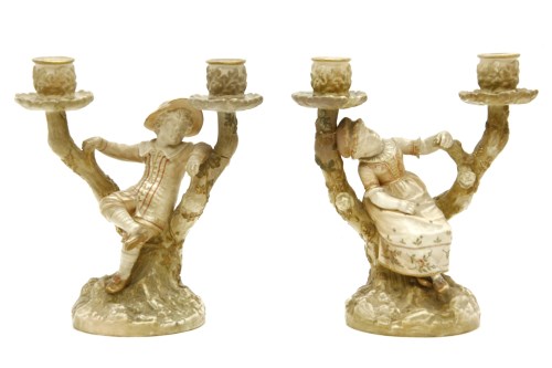 Lot 318 - A pair of Royal Worcester twin branch candelabra