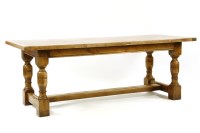 Lot 671 - An oak refectory table