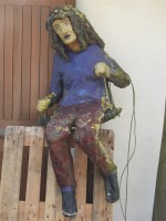 Lot 680 - A papier mache full size model of a girl on a swing