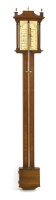 Lot 451 - A Georgian style walnut stick barometer