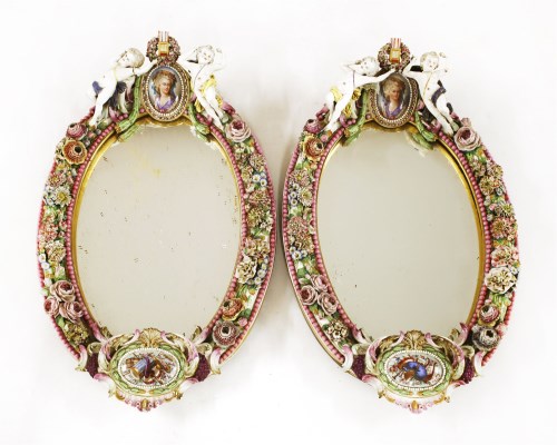 Lot 133 - A large pair of Dresden oval mirrors