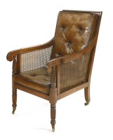 Lot 582 - A Regency mahogany bergère library armchair