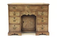 Lot 572 - A George III mahogany kneehole desk