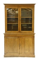 Lot 520 - An oak glazed bookcase