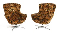 Lot 676 - A pair of revolving lounge chairs