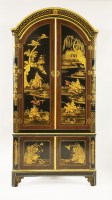 Lot 517 - A large japanned corner cupboard