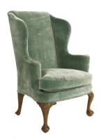 Lot 571 - A Georgian style wingback armchair