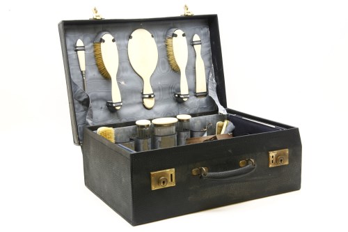 Lot 165 - A blue leather dressing case