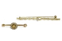 Lot 23 - A 9ct gold single stone diamond two row twisted bar brooch