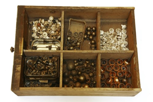 Lot 224 - A box of brass box feet and knobs