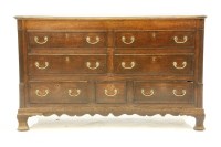 Lot 677 - A George III oak dresser