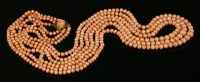 Lot 46 - An early 20th century three row graduated coral bead necklace