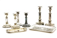 Lot 254 - A set of four 19th century Sheffield plated telescopic candlesticks