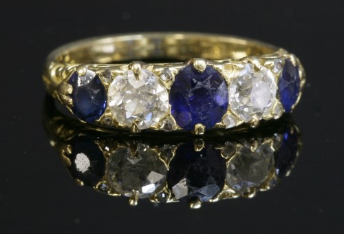 Lot 56 - A late Victorian sapphire and diamond carved head ring
