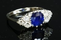 Lot 155 - A seven stone sapphire and diamond boat-shaped ring
