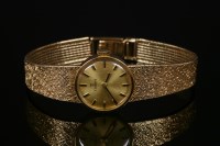 Lot 444 - A ladies' 9ct gold Tissot mechanical bracelet watch