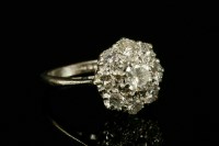 Lot 168 - A white gold nine stone diamond cluster ring
