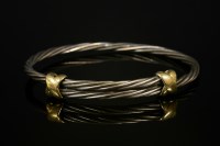 Lot 301 - A sterling silver and 18ct gold adjustable bangle