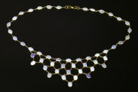 Lot 379 - An opal gold bib necklace