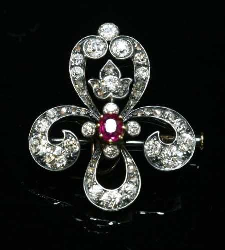 Lot 49 - A Continental ruby and diamond fleur-de-lys brooch