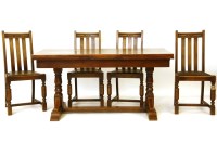 Lot 554 - A mid 20th century draw leaf table and four chairs