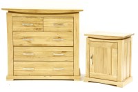 Lot 584 - A contemporary oak chest of drawers and pot cupboard