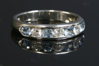Lot 367 - A platinum aquamarine and diamond half eternity ring