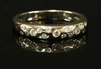 Lot 411 - A platinum diamond set band ring