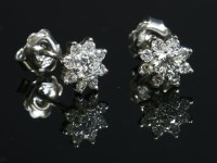 Lot 415 - A pair of 18ct white gold diamond set cluster earrings