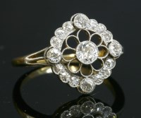 Lot 122 - A Belle Époque diamond set cluster ring