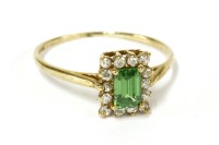 Lot 16 - A 9ct gold emerald cut green tourmaline and cubic zirconia rectangular cluster ring