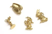 Lot 58 - Four gold charms