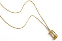 Lot 53 - An hourglass charm on a Prince of Wales chain