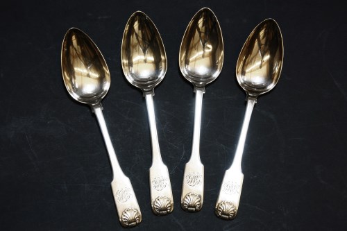 Lot 98 - A set of four George III silver table spoons