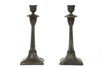 Lot 113 - A pair of WMF style pewter candlesticks