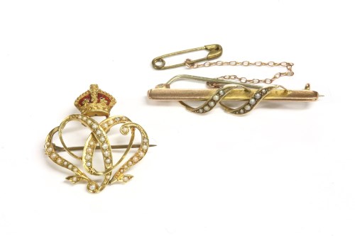 Lot 26 - A gold enamel and seed pearl 1902 coronation brooch