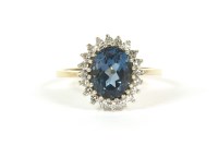 Lot 38 - A 9ct gold blue topaz and diamond cluster ring